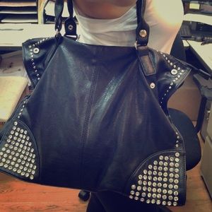 Black bag with studs.  Never worn. With tags